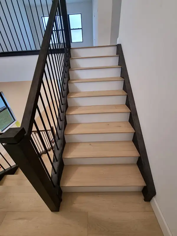 Light oak stair treads with black balusters