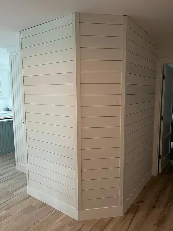 White shiplap accent wall