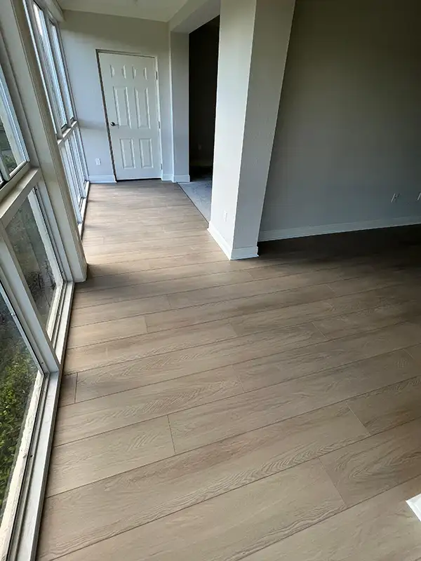 Wide plank wood-look floor in a hallway